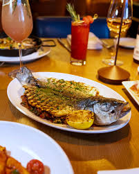 Brezza signature dishes Whole Grilled BranzinoBucatini all'AmatricianaDry-Aged Bistecca Fiorentina